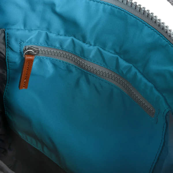 Roka Bantry B marine recycled nylon interior pocket with zipper and leather pull, blue waterproof fabric.