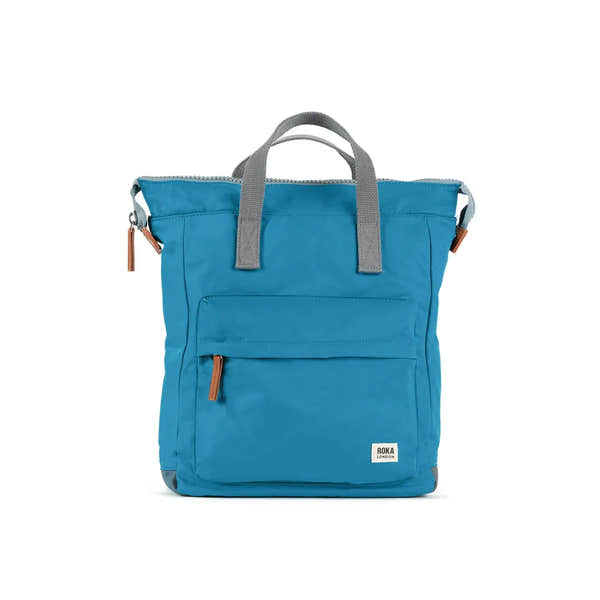 Roka Bantry B Marine recycled nylon backpack in bright blue with gray handles and brown zipper pulls, stylish eco-friendly design.