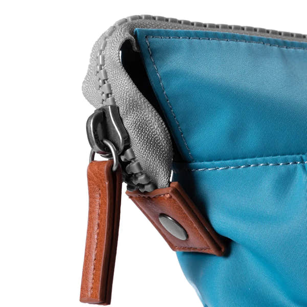 Roka Bantry B Petrol recycled nylon bag with grey trim, leather accent, and zipper closure.