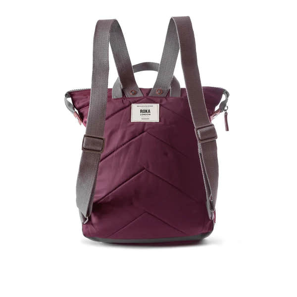 Roka Bantry B Plum Recycled Nylon backpack with adjustable straps, quilted design, and front label.