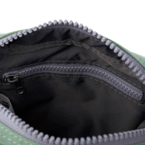 Roka Bond Frost recycled canvas bag interior with zip pocket, black lining, and durable stitching, one size.
