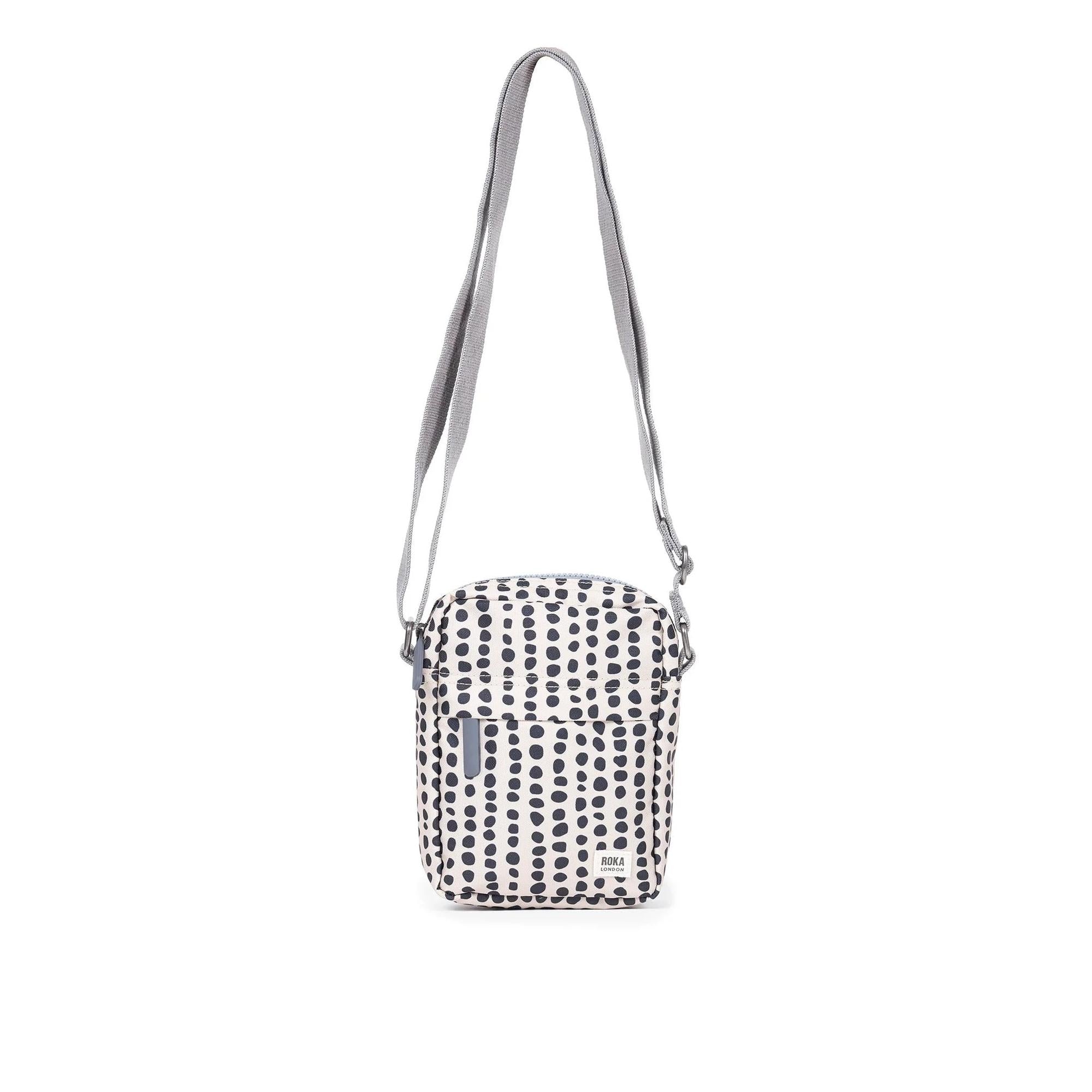 Roka Bond Linear Dot Recycled Canvas Crossbody Bag, one size, black and white dotted pattern, adjustable gray strap.