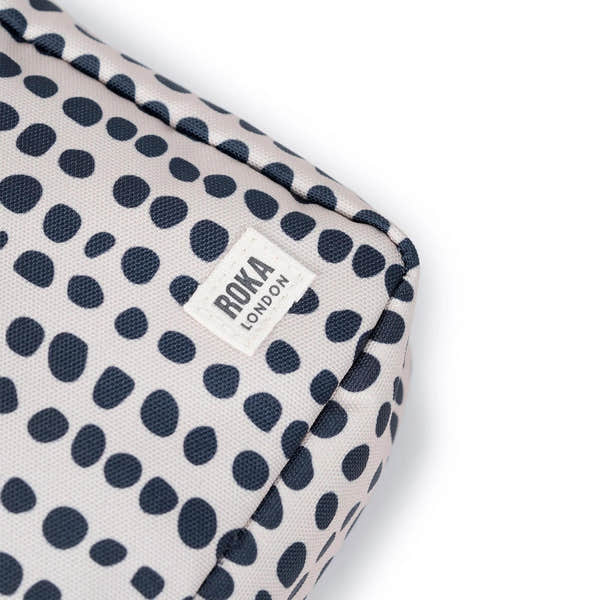 Roka Bond linear dot recycled canvas bag, one size, navy and white polka dot pattern, brand label detail.