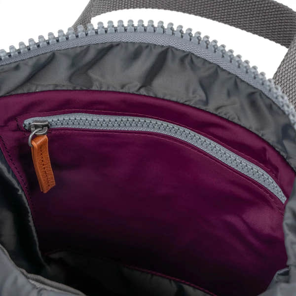 Roka Canfield B Royal Burgundy recycled nylon backpack interior with zippered pocket and durable fabric.