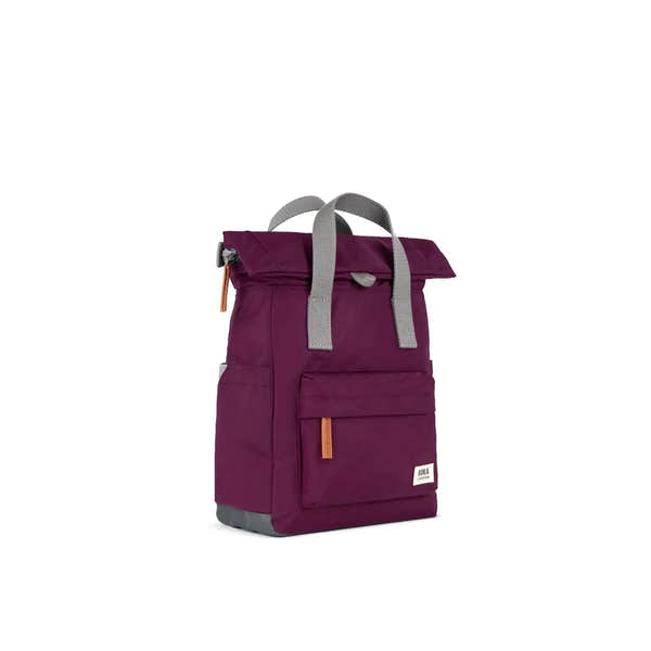 Roka Canfield B Royal Burgundy recycled nylon backpack with gray handles and orange accents, front pocket, white logo label.
