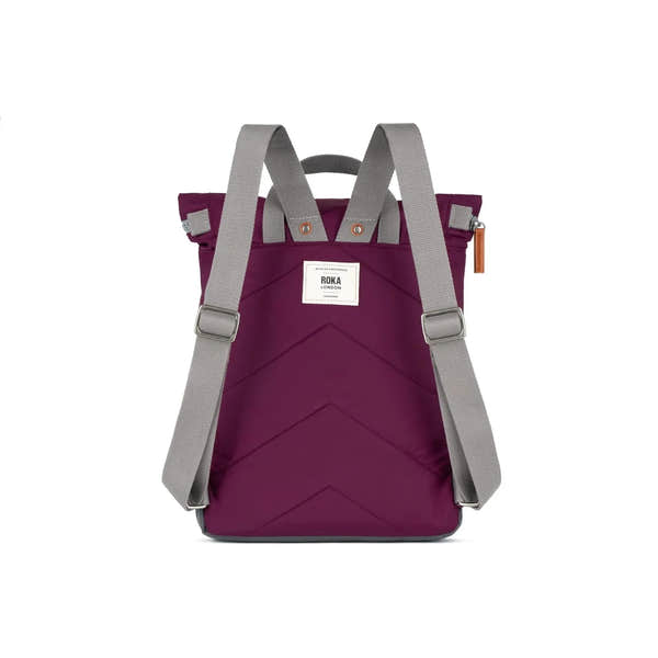 Roka Canfield B Royal Burgundy Recycled Nylon Backpack with gray adjustable straps and front logo patch.