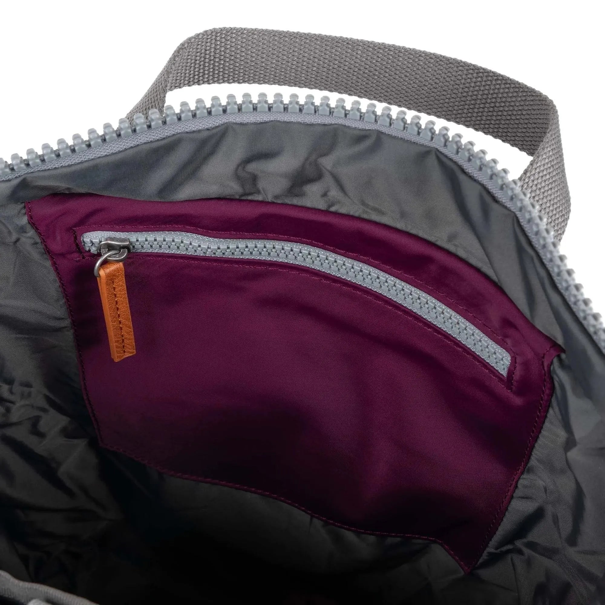 Roka Canfield B Royal Burgundy recycled nylon interior of a tote bag with zippered pocket and gray fabric handle.