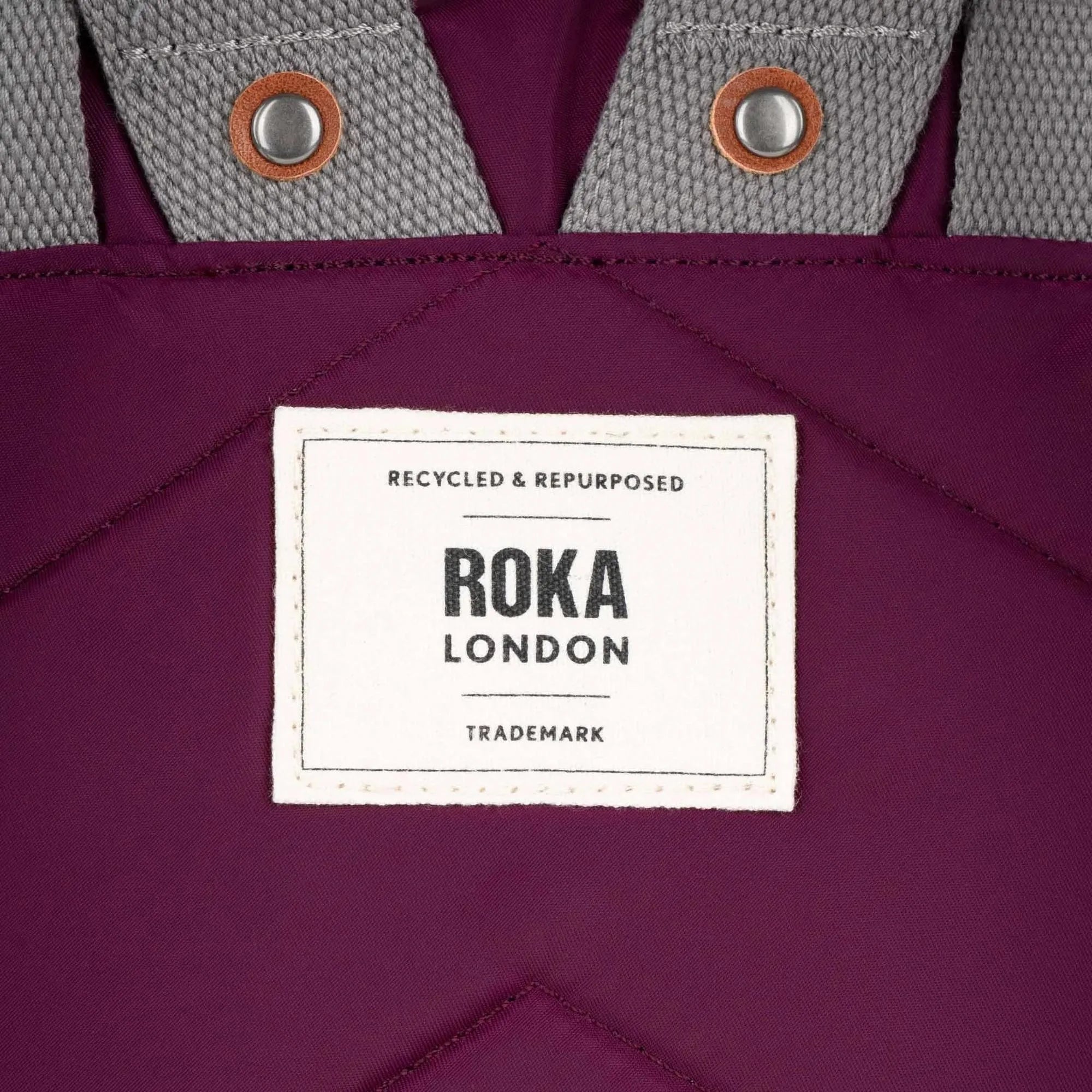 Roka Canfield B Royal Burgundy recycled nylon tote bag with gray textured handles and white label detail.