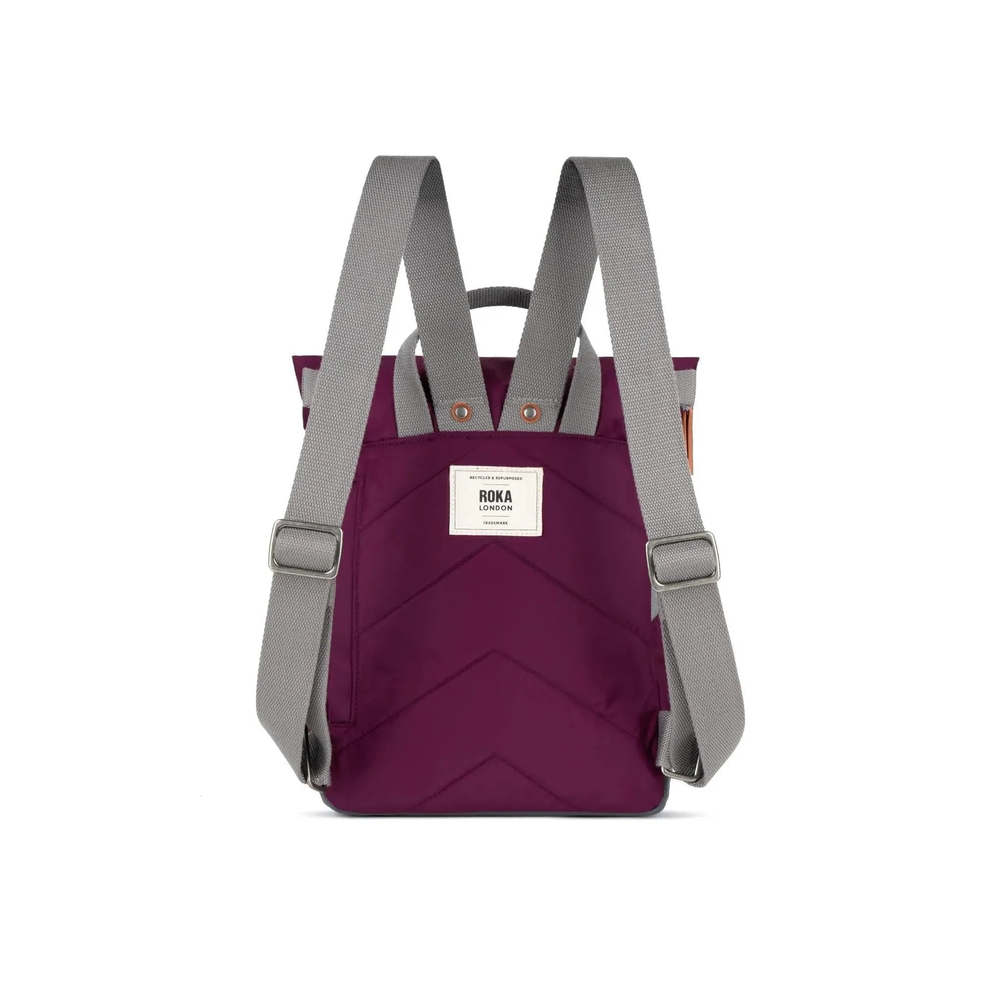 Roka Canfield B Royal Burgundy recycled nylon backpack with gray adjustable straps and front logo patch.