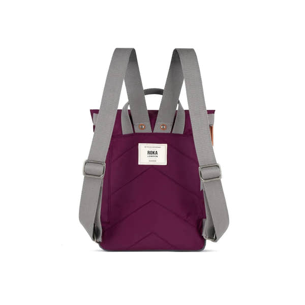 Roka Canfield B Royal Burgundy recycled nylon backpack with gray adjustable straps and front logo patch.