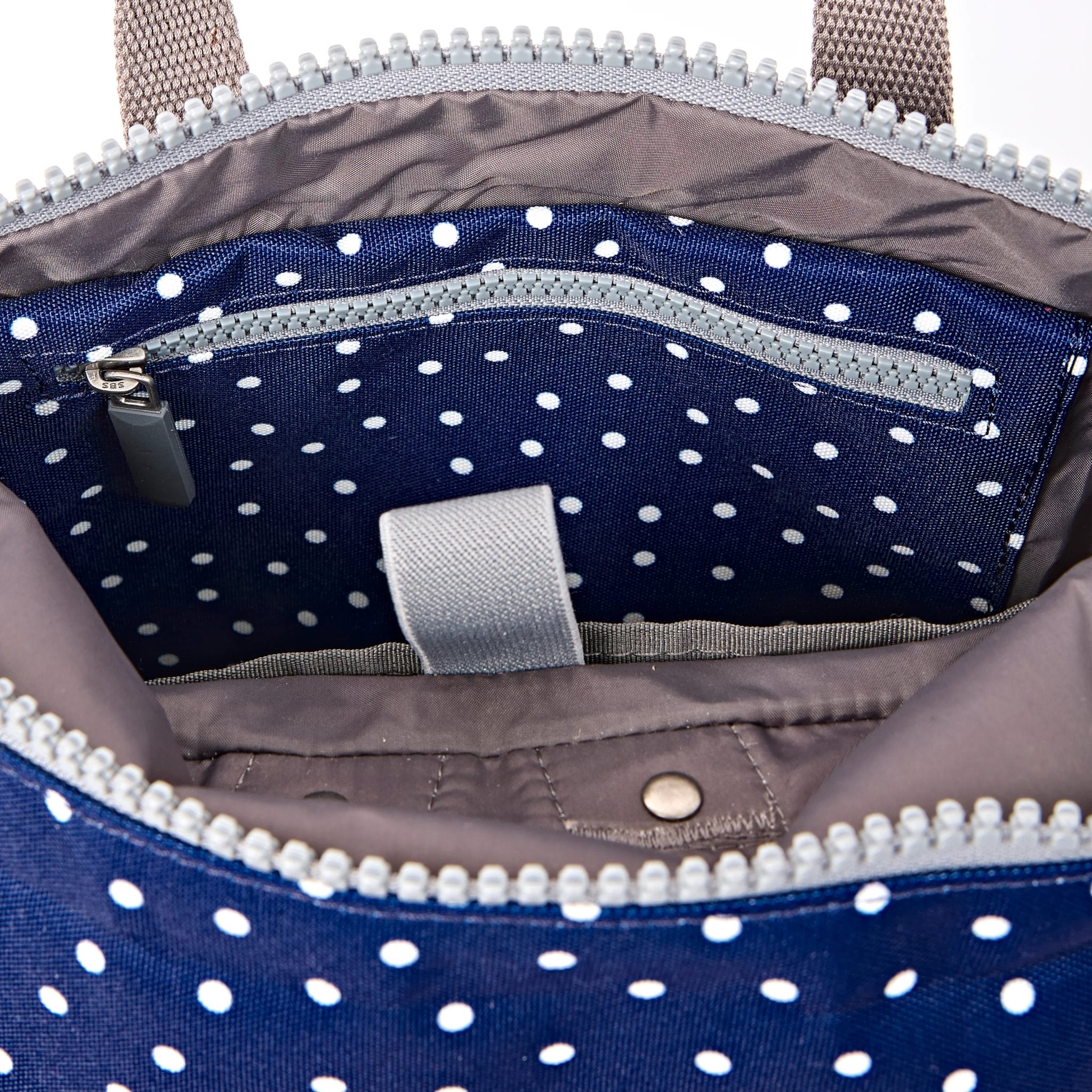 Roka Canfield Small Navy Polka Dot Recycled Canvas Backpack, second interior view.