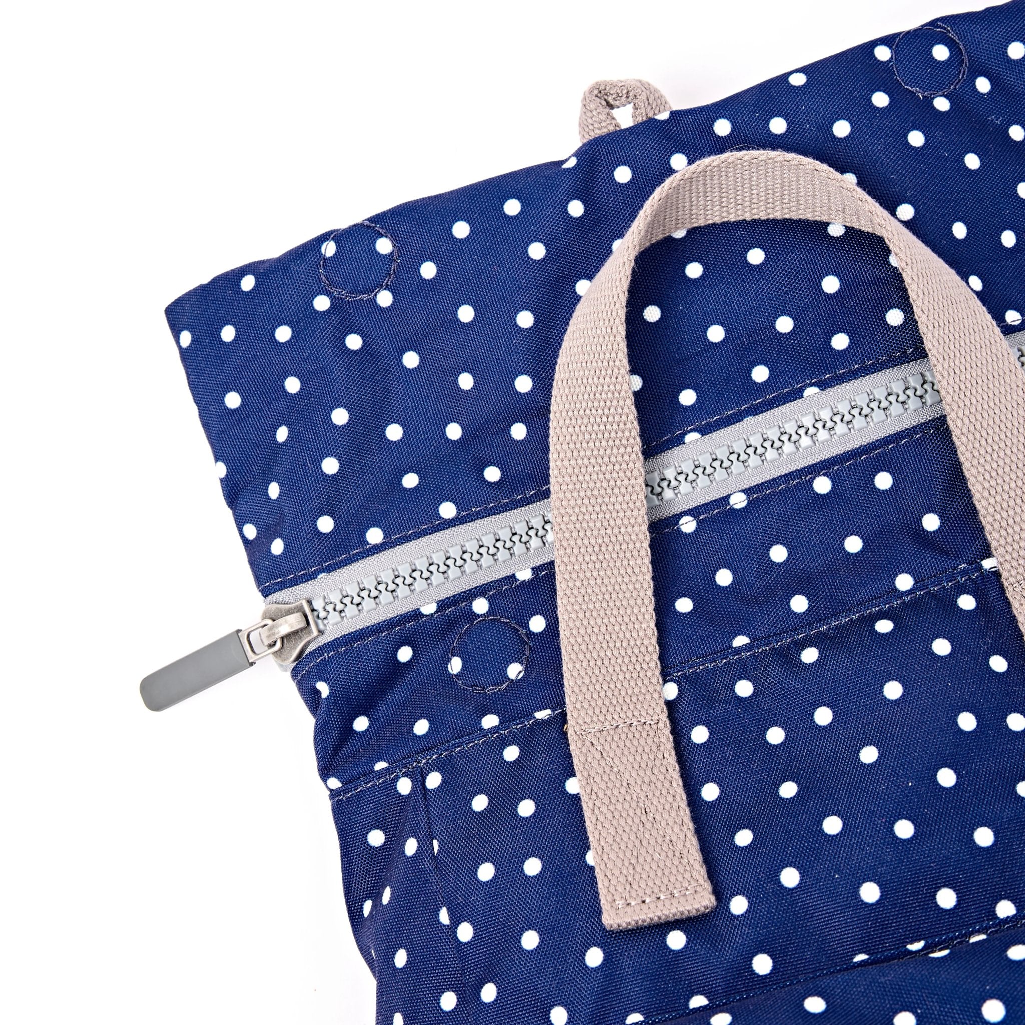 Roka Canfield Small Navy Polka Dot Recycled Canvas Backpack, zip detail.