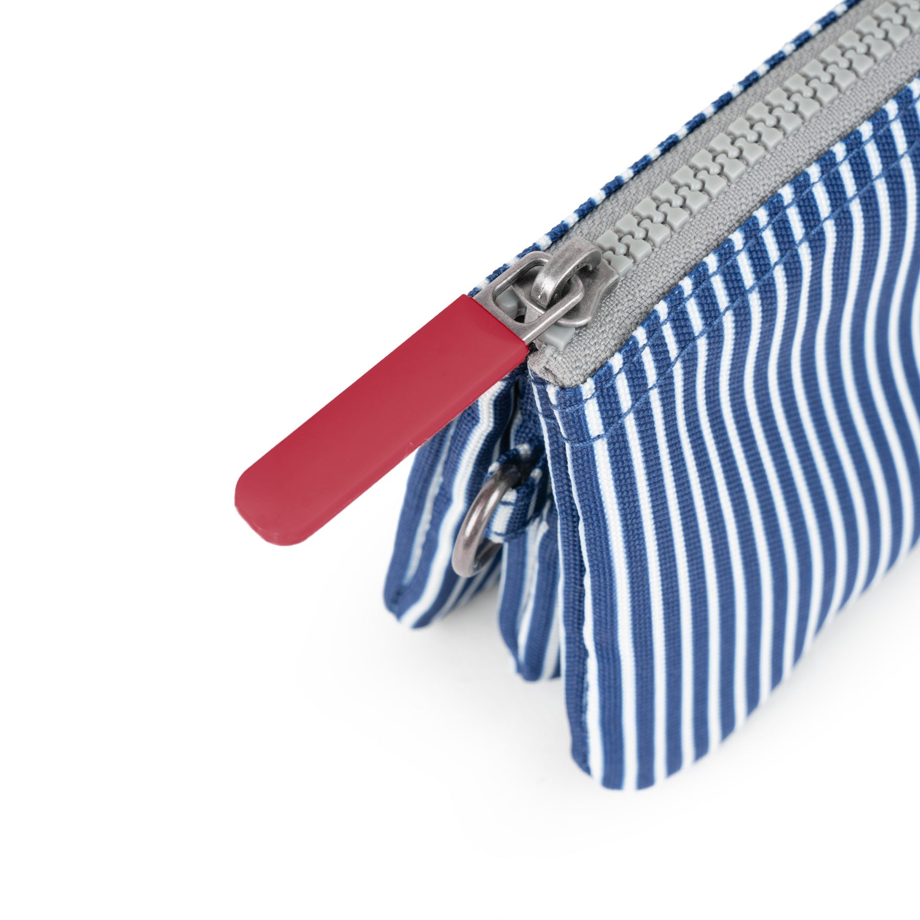 Roka Carnaby Blue Hickory Recycled Canvas bag with zipper closure and striped fabric design.