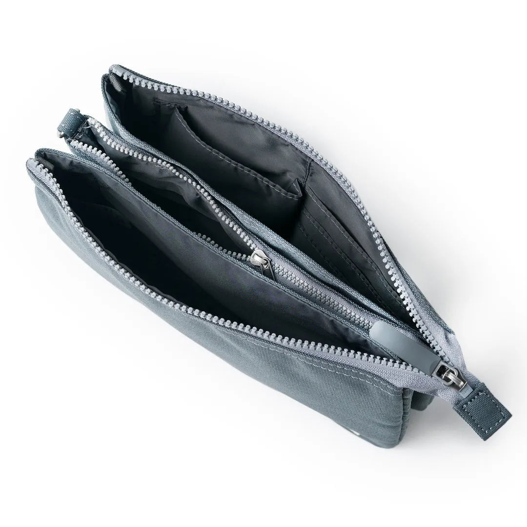 Roka Carnaby Crossbody Bag in Smoke XL recycled canvas, with multiple compartments, zip closures, and black interior lining.