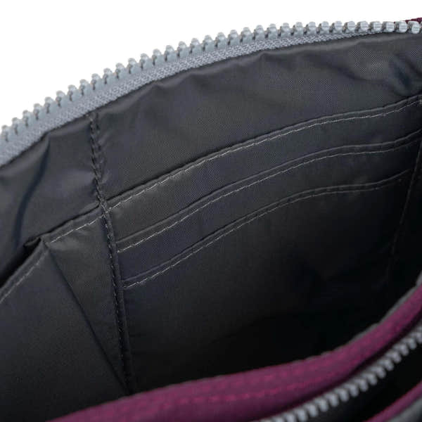 Roka Carnaby Crossbody XL Cherry handbag with recycled canvas, featuring multiple interior card slots and a spacious main compartment.