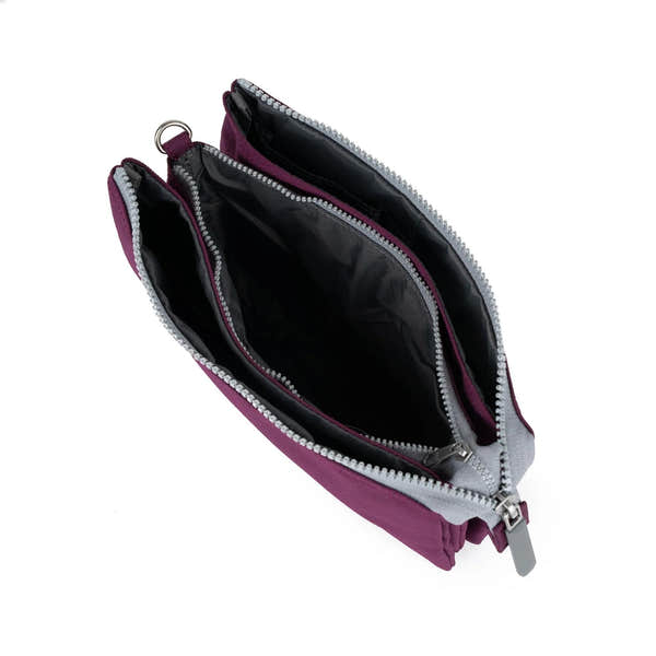 Roka Carnaby Crossbody XL bag with cherry lacquer recycled canvas, spacious interior, multiple compartments, silver zippers, and black lining.