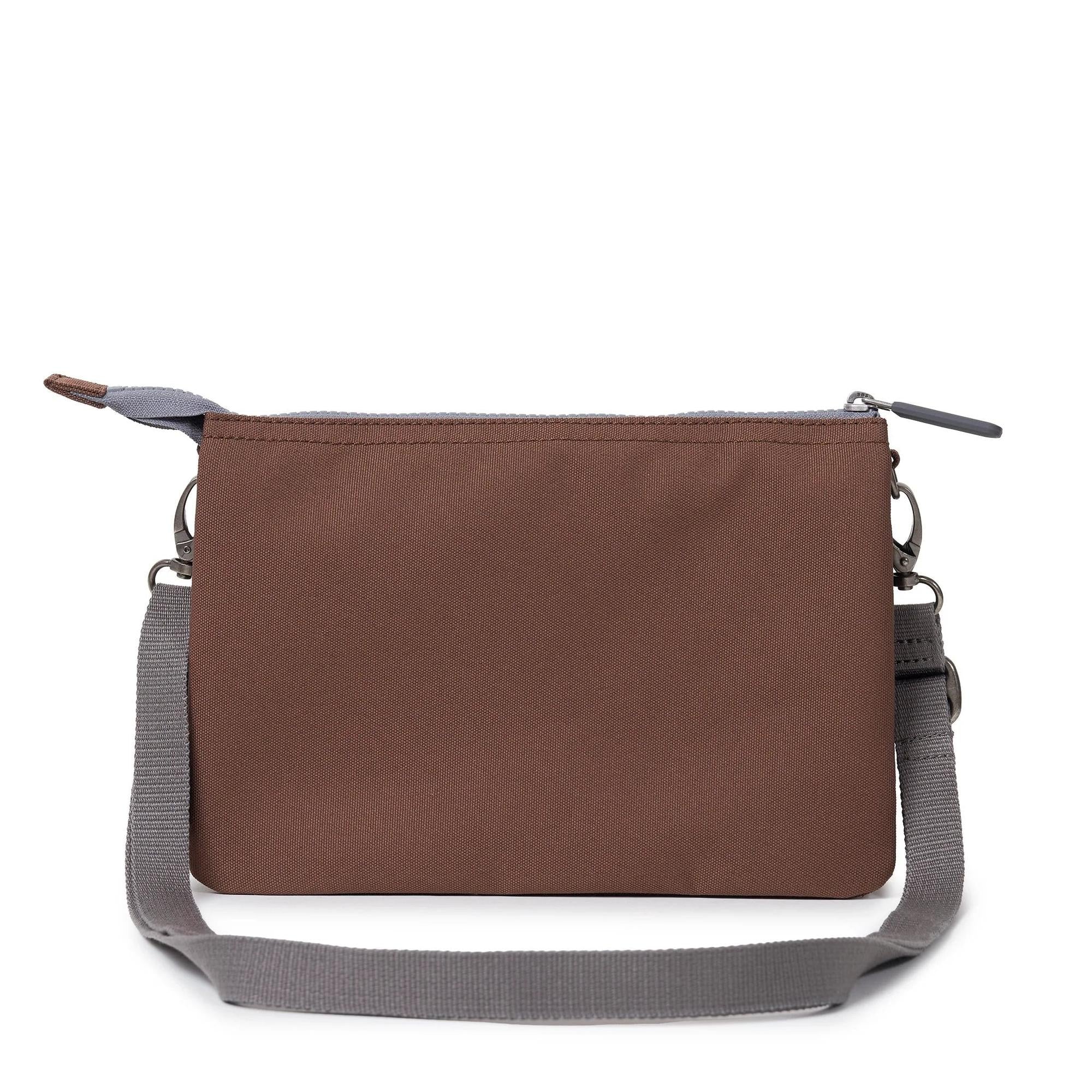 Roka Carnaby Crossbody XL bag in coco recycled canvas with adjustable gray strap and zip closure.