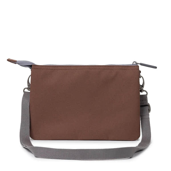 Roka Carnaby Crossbody XL bag in coco recycled canvas with adjustable gray strap and zip closure.