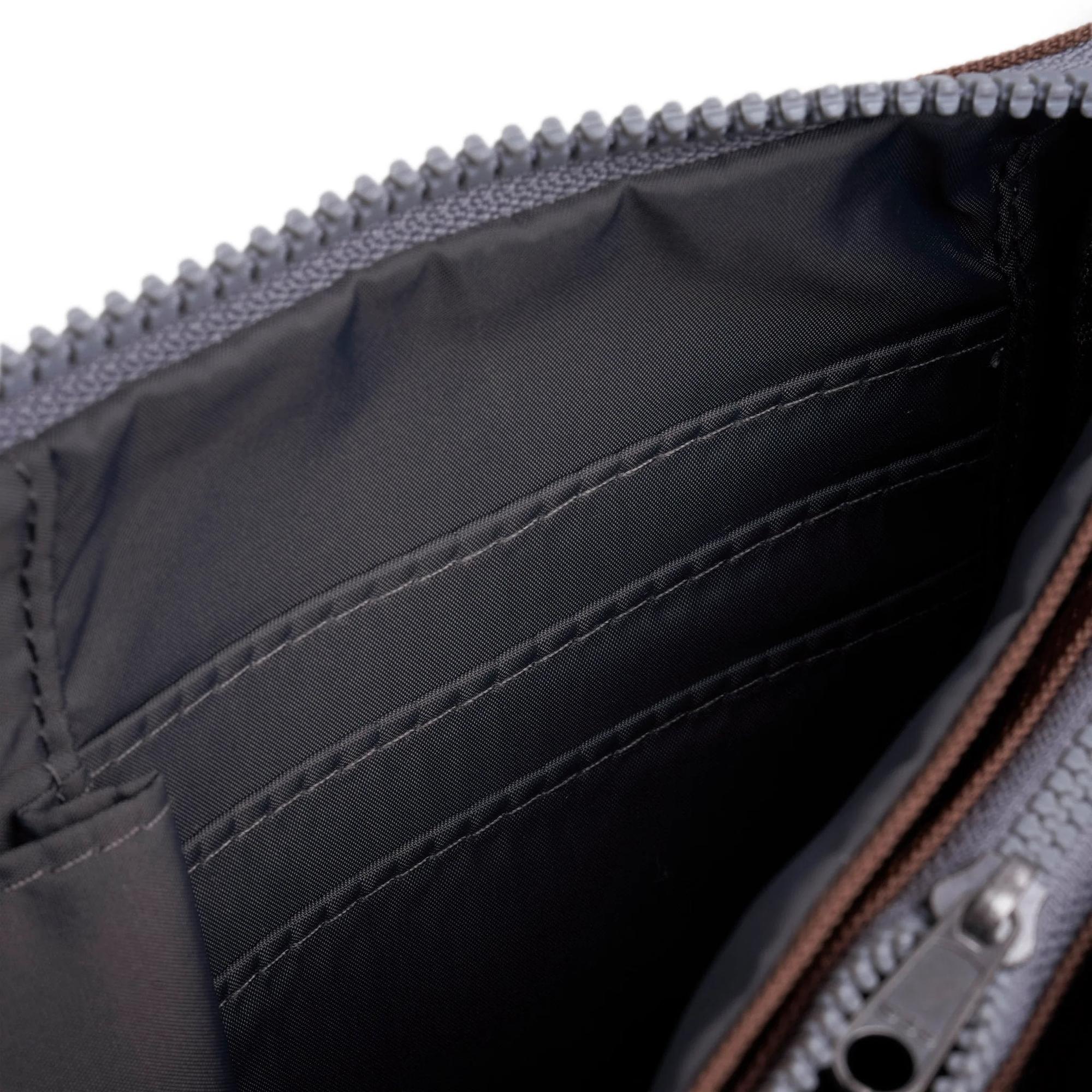 Roka Carnaby Crossbody XL in Coco recycled canvas, large interior with multiple compartments, black lining, and silver zipper.