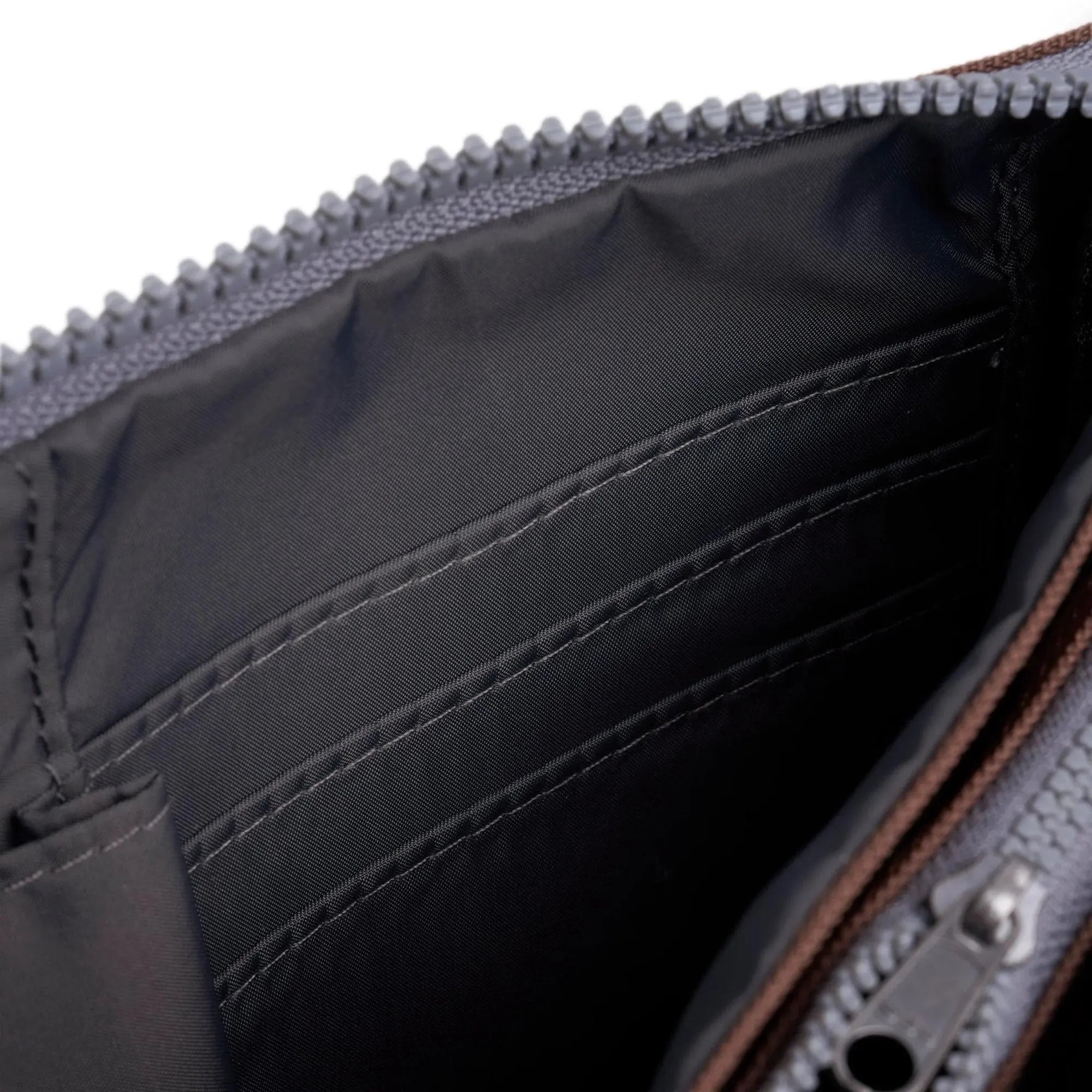 Roka Carnaby Crossbody XL in Coco recycled canvas, large interior with multiple compartments, black lining, and silver zipper.