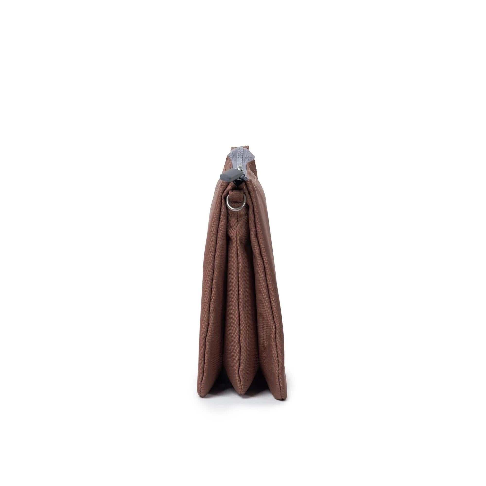 Roka Carnaby Crossbody XL Coco Recycled Canvas bag, large brown, eco-friendly, with silver hardware, side view.