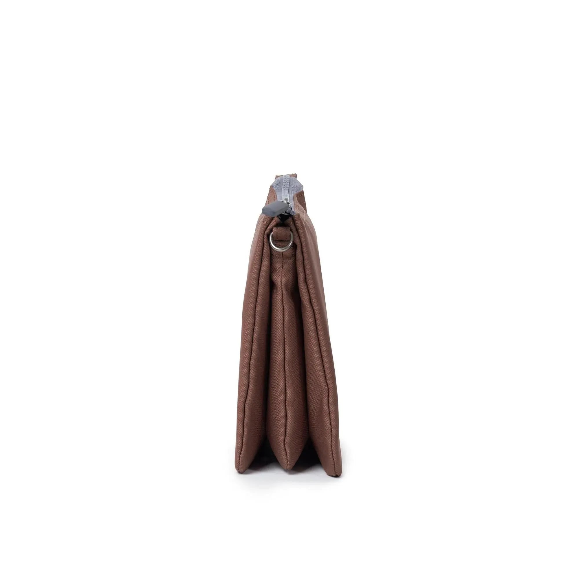 Roka Carnaby Crossbody XL Coco Recycled Canvas bag, large brown, eco-friendly, with silver hardware, side view.
