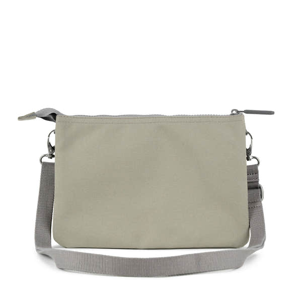 Roka Carnaby Crossbody XL bag in coriander recycled canvas with adjustable gray strap and zip closure.