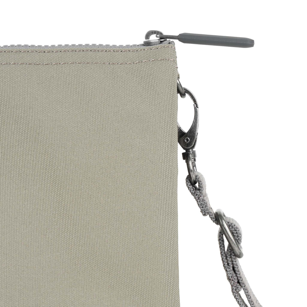 Roka Carnaby Crossbody XL in Coriander recycled canvas with a top zipper and adjustable strap featuring sturdy metal hardware.
