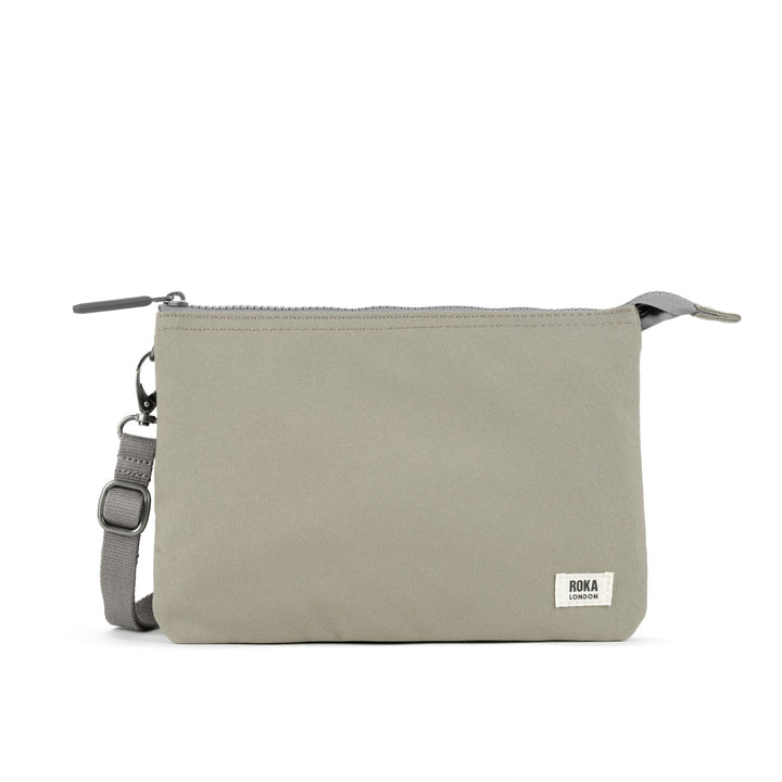 Roka Carnaby Crossbody XL in Coriander recycled canvas with adjustable strap and zip closure, compact and eco-friendly travel bag.