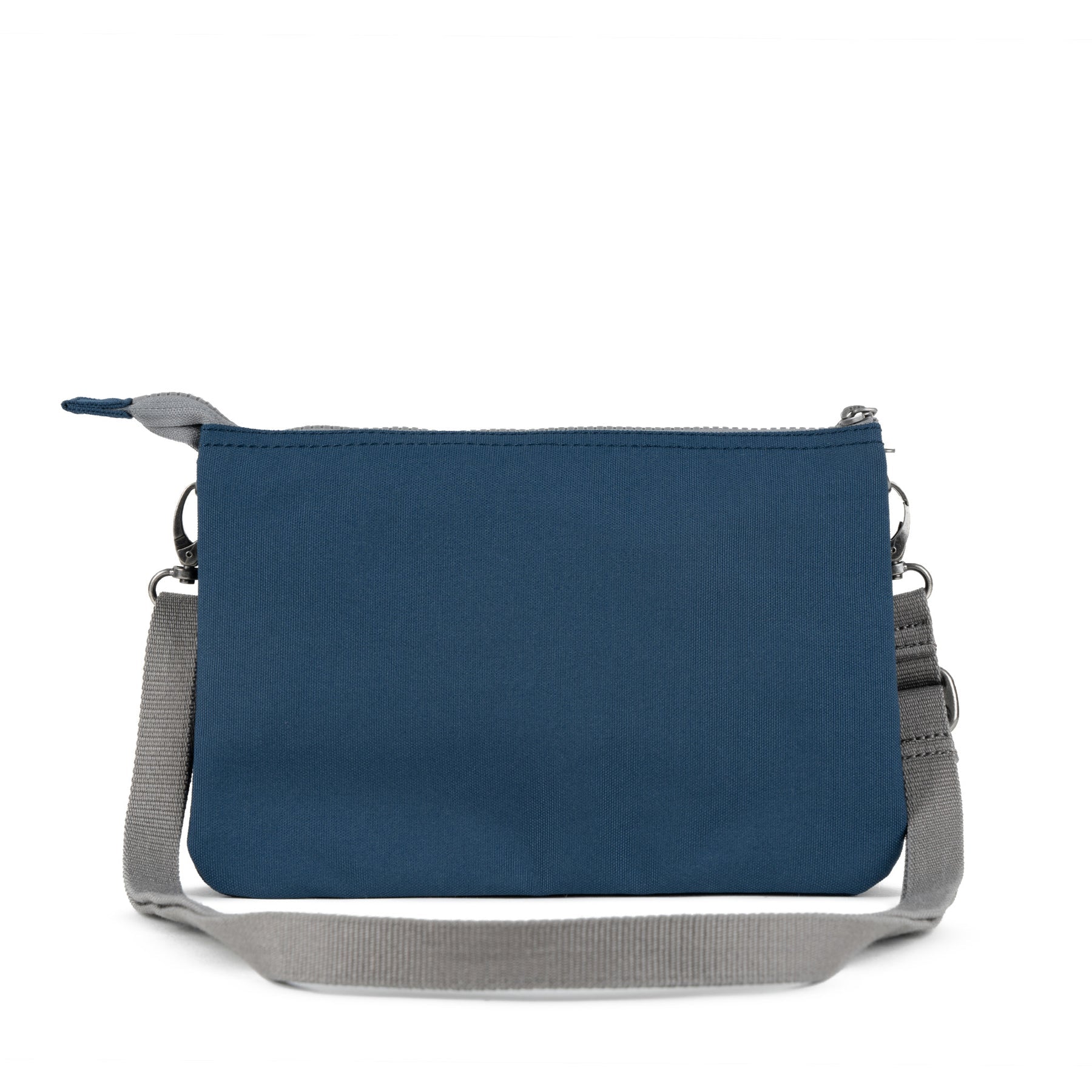 Roka Carnaby Crossbody XL bag in deep blue recycled canvas with adjustable gray strap and silver hardware.