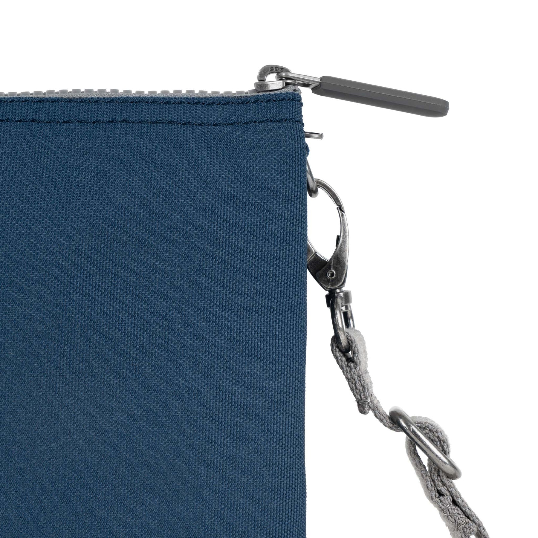 Roka Carnaby Crossbody XL bag in deep blue recycled canvas with top zipper closure and adjustable strap.