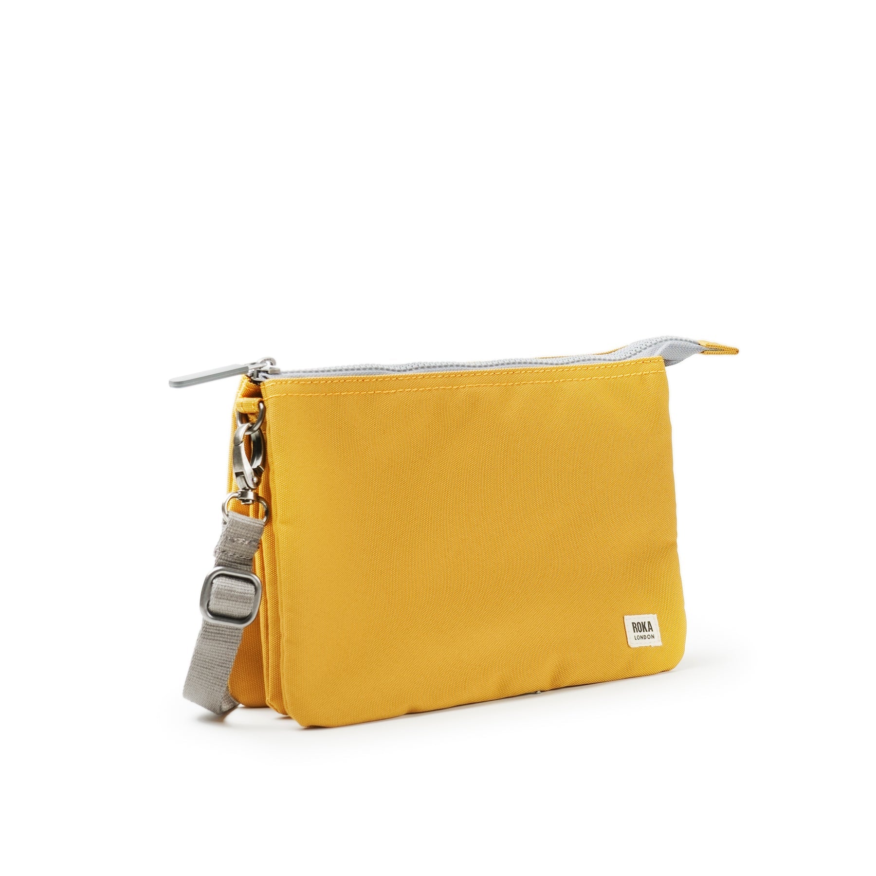 Roka Carnaby Crossbody XL Flax bag made of recycled canvas with adjustable strap and silver hardware, compact and eco-friendly.