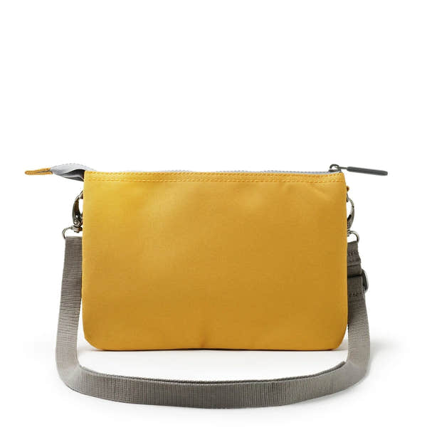Roka Carnaby Crossbody XL bag in flax recycled canvas with gray strap and zip closure, stylish eco-friendly design.