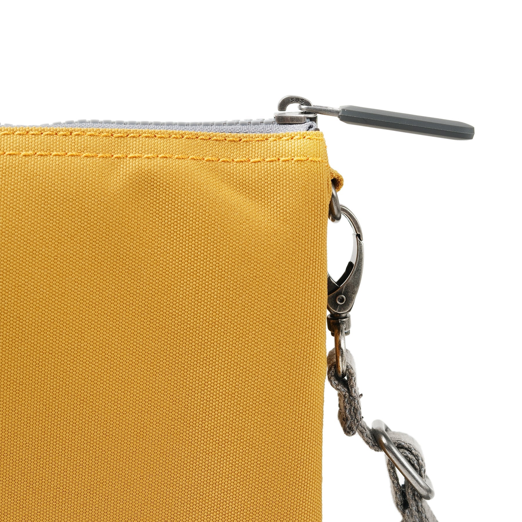 Roka Carnaby Crossbody XL Bag in Flax recycled canvas with zipper closure and metal clip strap attachment.