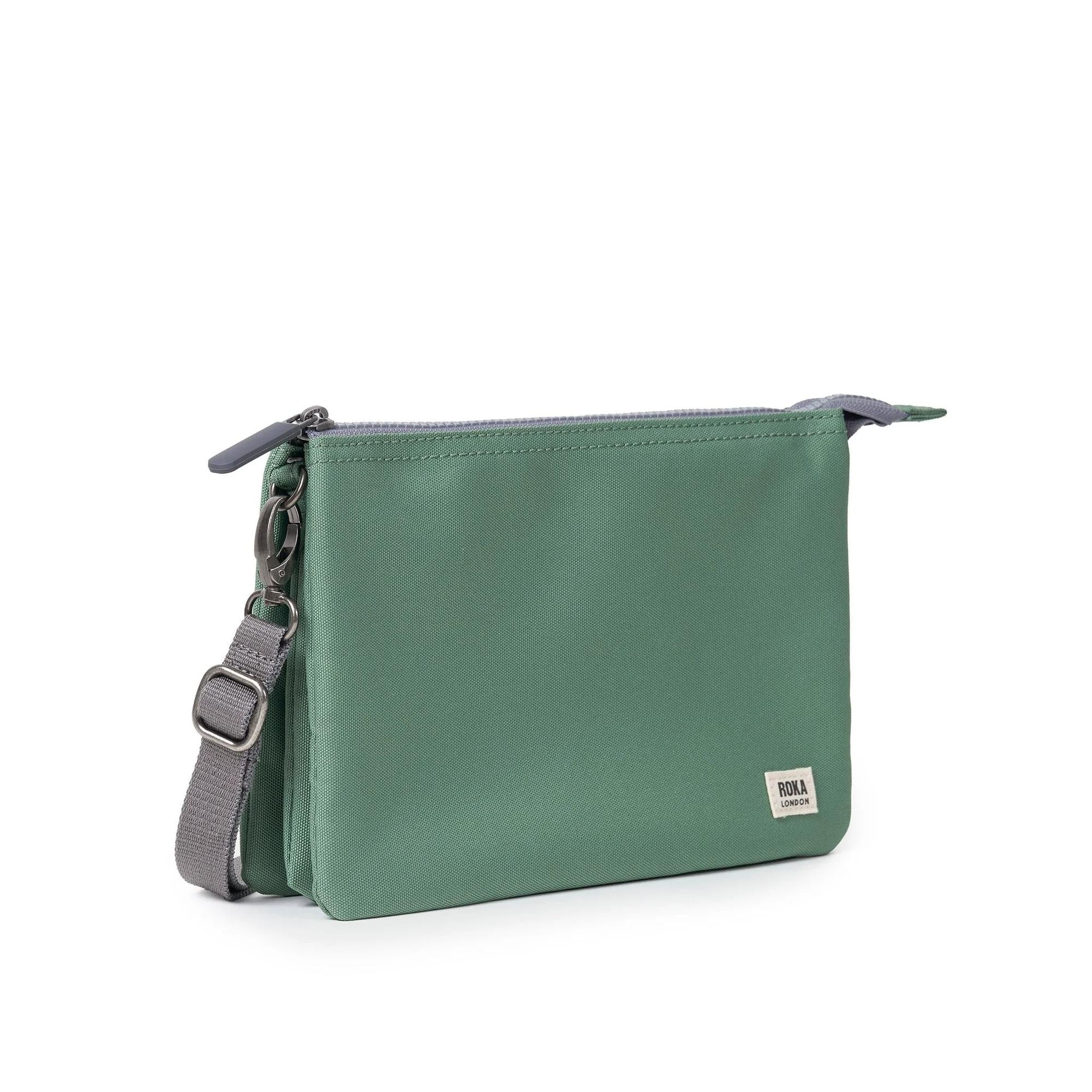Roka Carnaby Crossbody XL Frost recycled canvas bag with adjustable strap, zipper closure, and small logo patch.