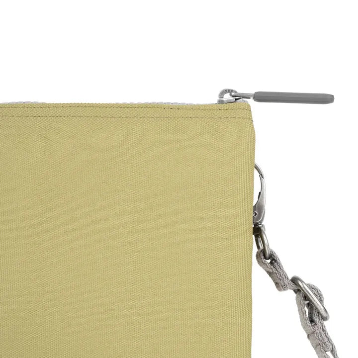 Roka Carnaby Crossbody XL bag in khaki recycled canvas with silver hardware and a detachable strap.