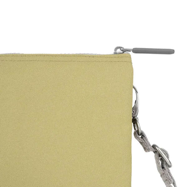 Roka Carnaby Crossbody XL bag in khaki recycled canvas with silver hardware and a detachable strap.