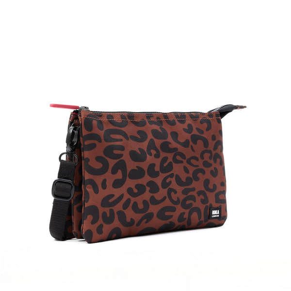 Roka Carnaby Crossbody XL leopard print recycled canvas bag, oversized, stylish, with adjustable strap, black hardware, and logo label.