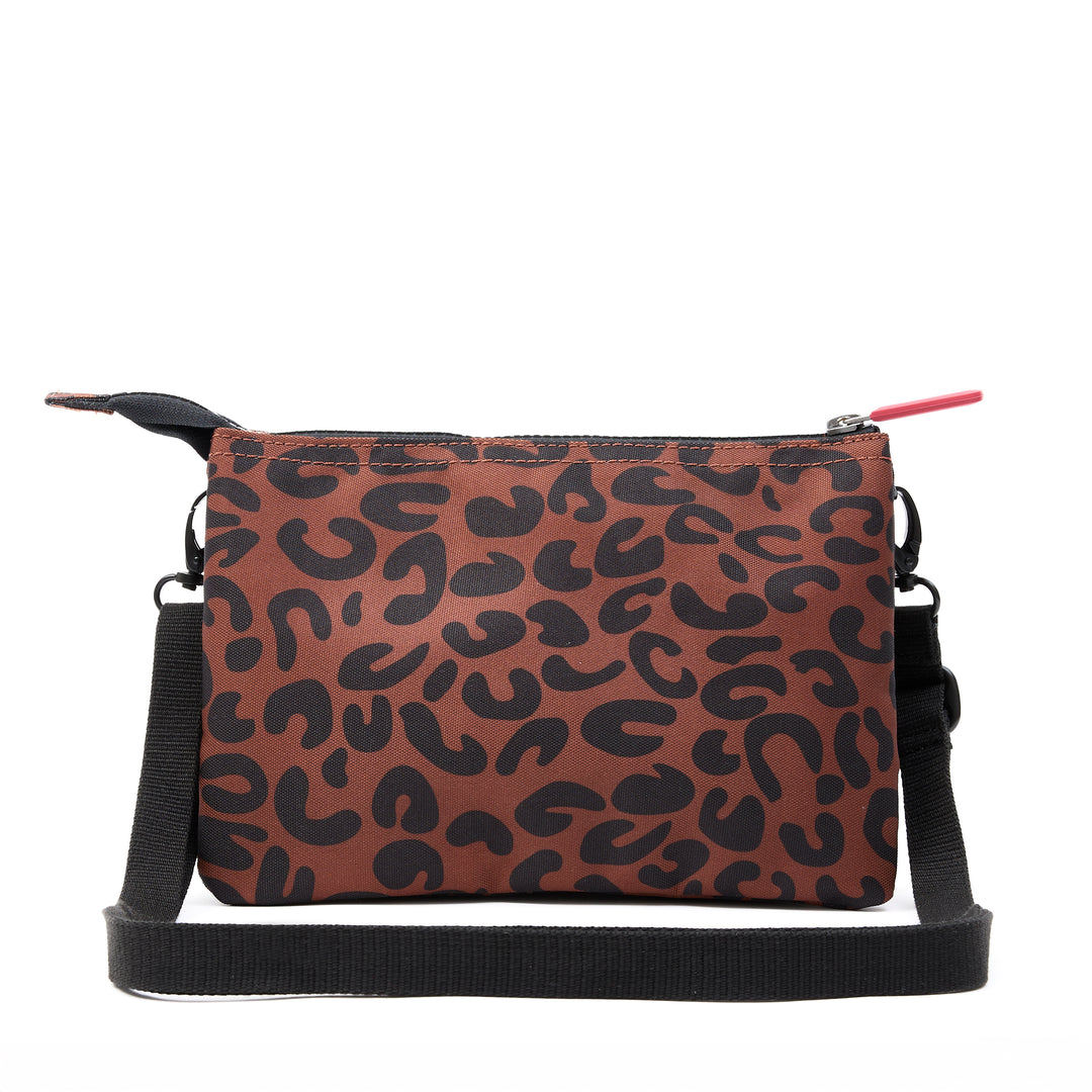Roka Carnaby Crossbody XL leopard print recycled canvas bag with adjustable strap and zip closure.