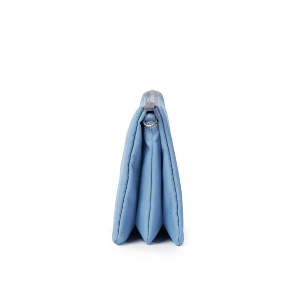Roka Carnaby Crossbody XL in retro blue recycled canvas, an extra-large, stylish, and eco-friendly bag with side view.