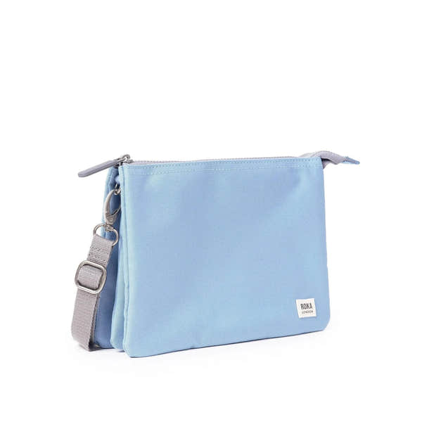 Roka Carnaby Crossbody XL in retro blue recycled canvas, large size with adjustable strap and silver hardware.