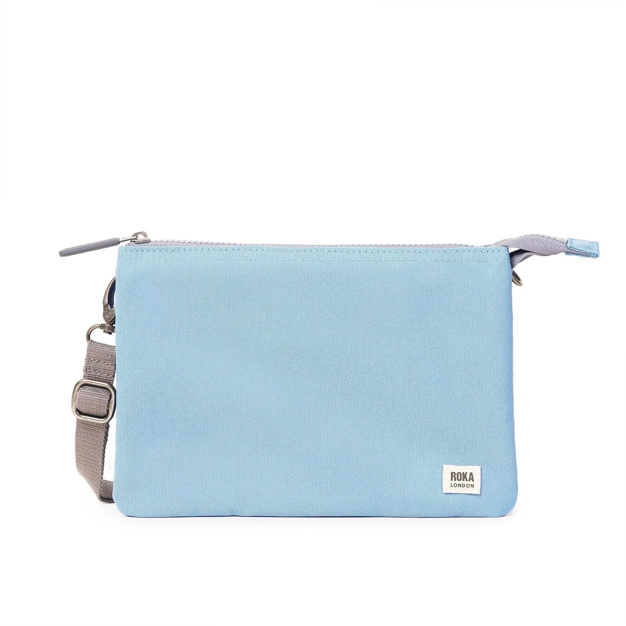 Roka Carnaby Crossbody XL in retro blue recycled canvas, oversized design, with adjustable strap and zipper closure.