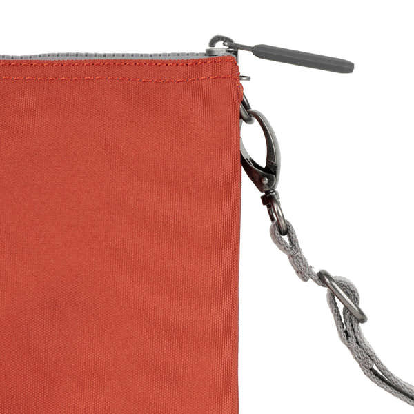 Roka Carnaby Crossbody XL handbag in Rooibos recycled canvas with black zipper and adjustable gray strap.