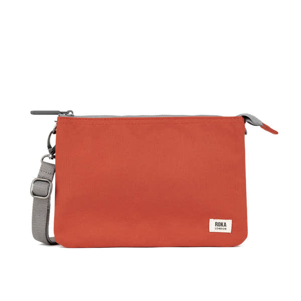 Roka Carnaby Crossbody XL bag in Rooibos recycled canvas, large orange design with adjustable gray strap and zip closure.