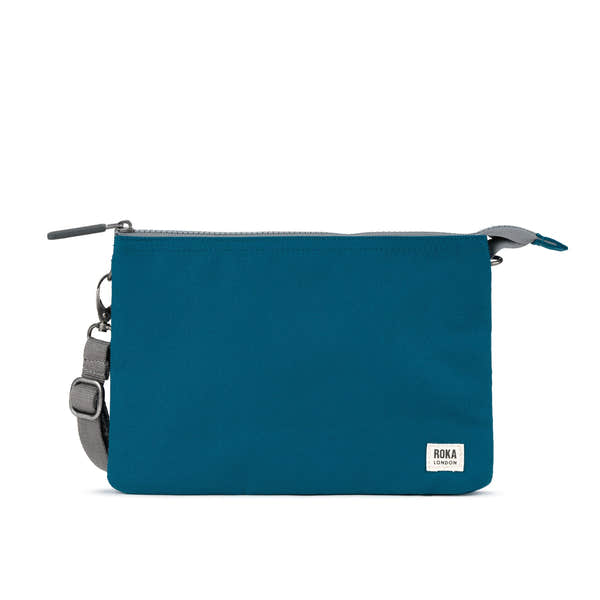 Roka Carnaby Crossbody XL in Sapphire recycled canvas, sleek design with adjustable strap and zip closure.