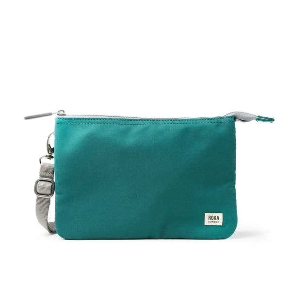 Roka Carnaby Crossbody XL Teal Recycled Canvas bag with adjustable strap and silver hardware, ideal for eco-friendly daily use.