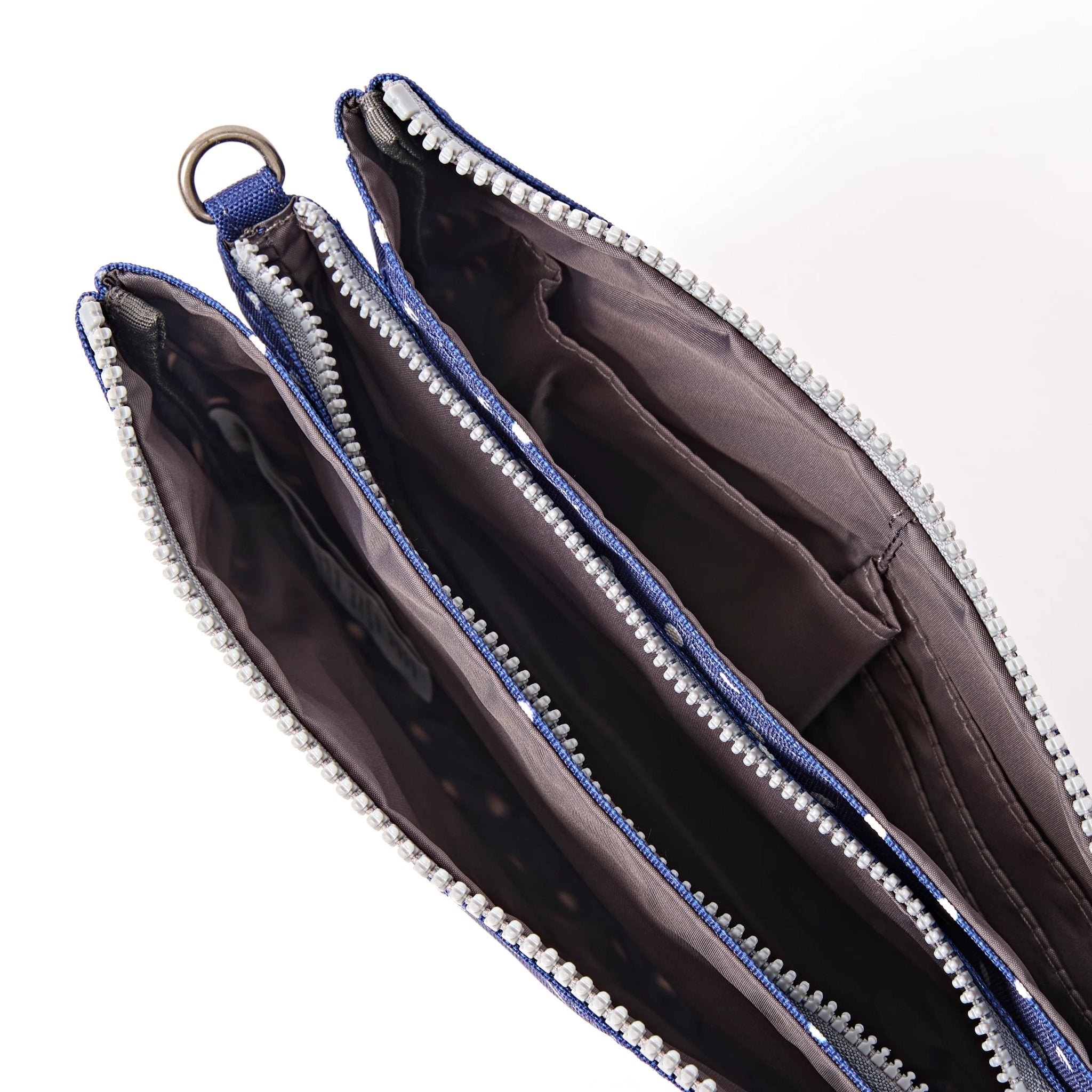 Roka Carnaby XL Navy Polka Dot Recycled Canvas Crossbody Bag, side view.