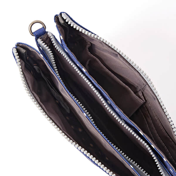 Roka Carnaby XL Navy Polka Dot Recycled Canvas Crossbody Bag, side view.