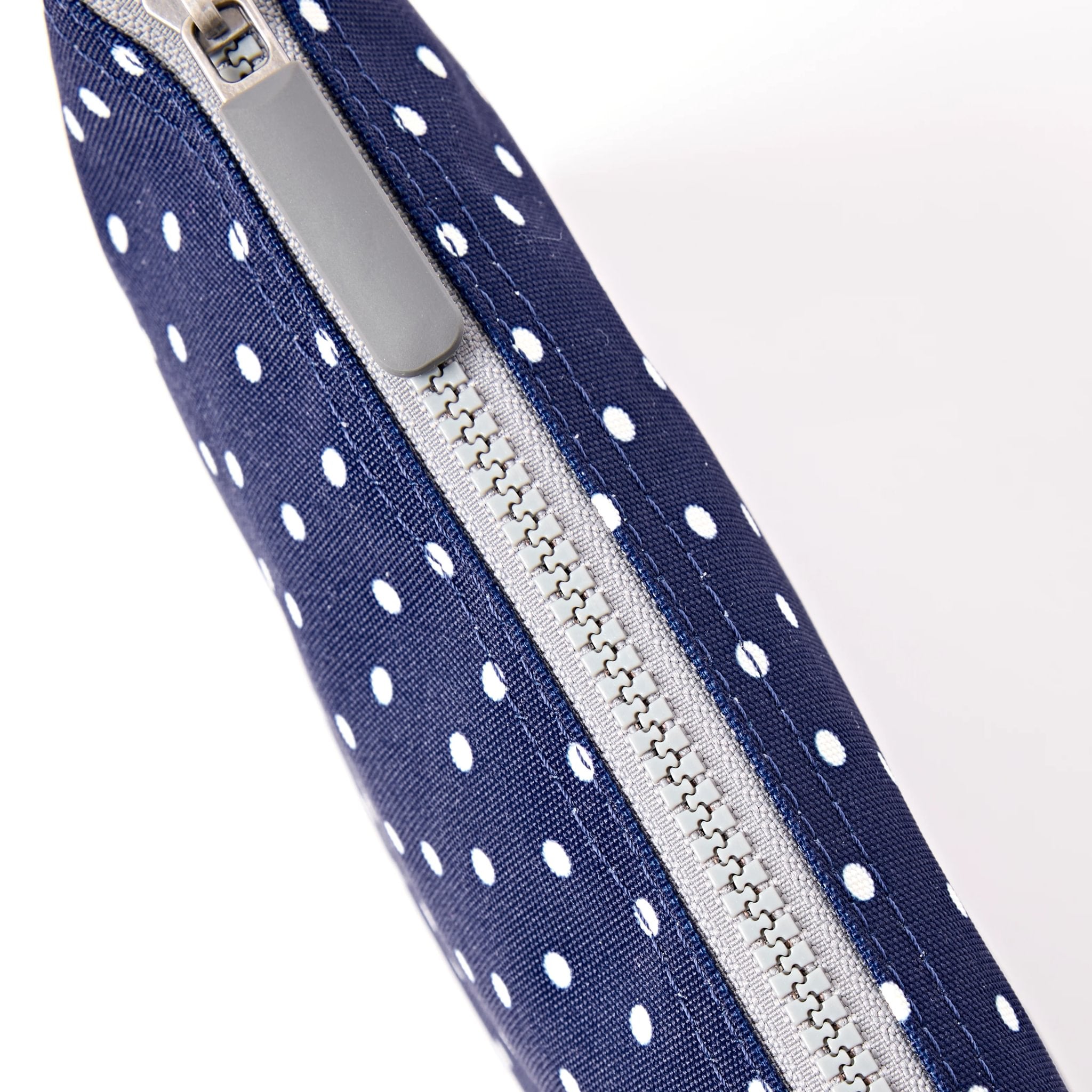 Roka Carnaby XL Navy Polka Dot Recycled Canvas Crossbody Bag, zip detail.