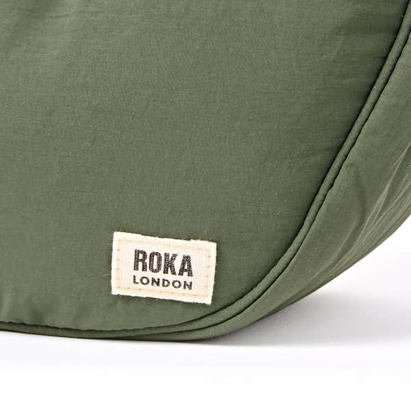 Roka Farringdon Olive Recycled Taslon Half Moon Bag, brand label detail.